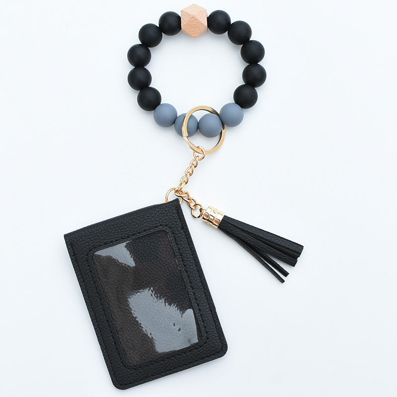 Comercio al por mayor Cuentas de silicona PU Titular de la tarjeta de color sólido Llavero de muñeca